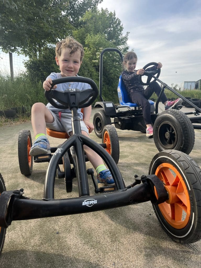Two kids Go-karting at Nore Valley Park.
