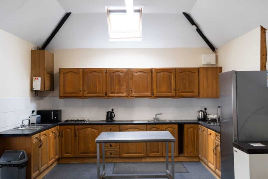 Campers kitchen, showing facilities available toaster, microwave, kettle, hob, fridge, freezer, two sinks and presses.